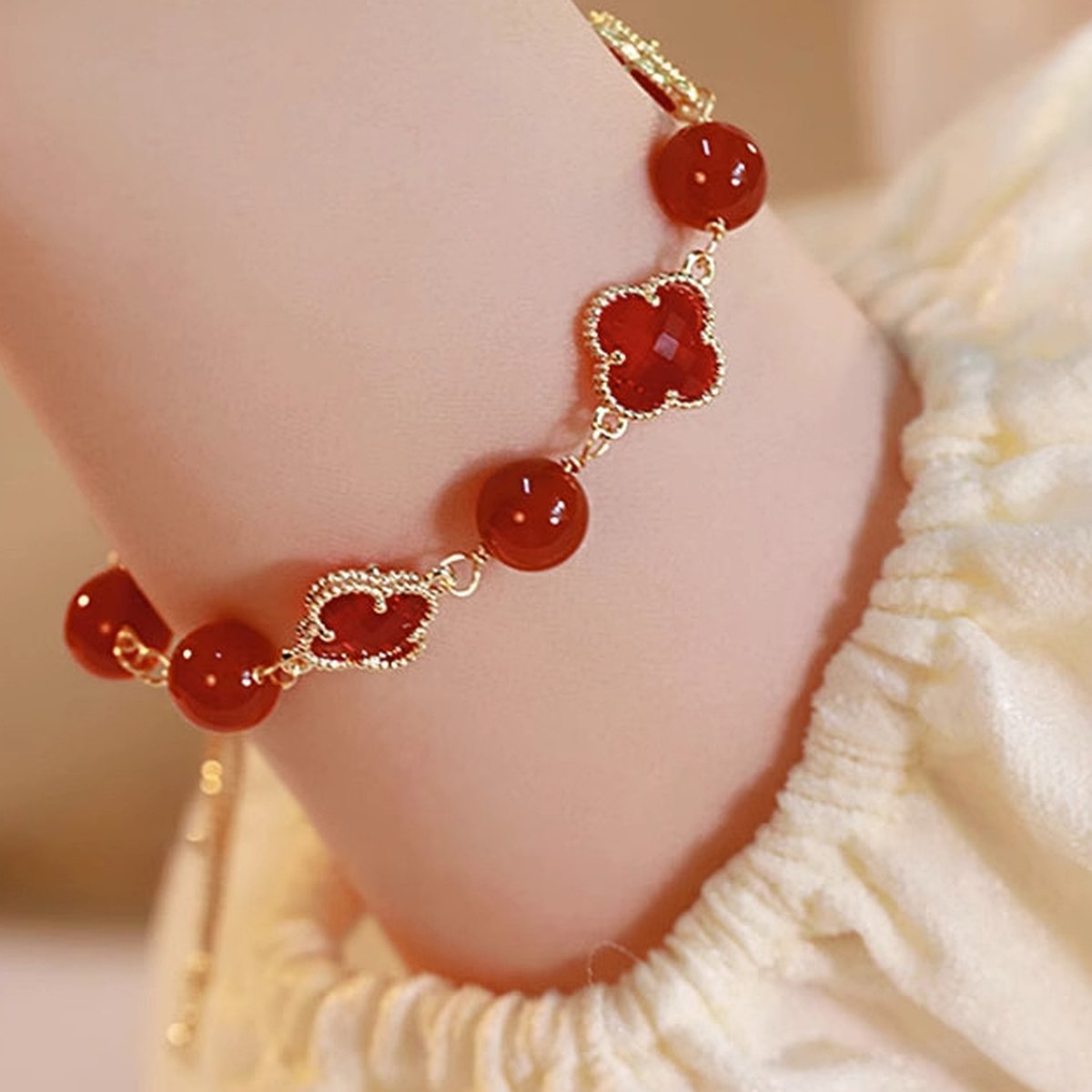 Red Clover Bead Bracelet flat lay detail thumbnail