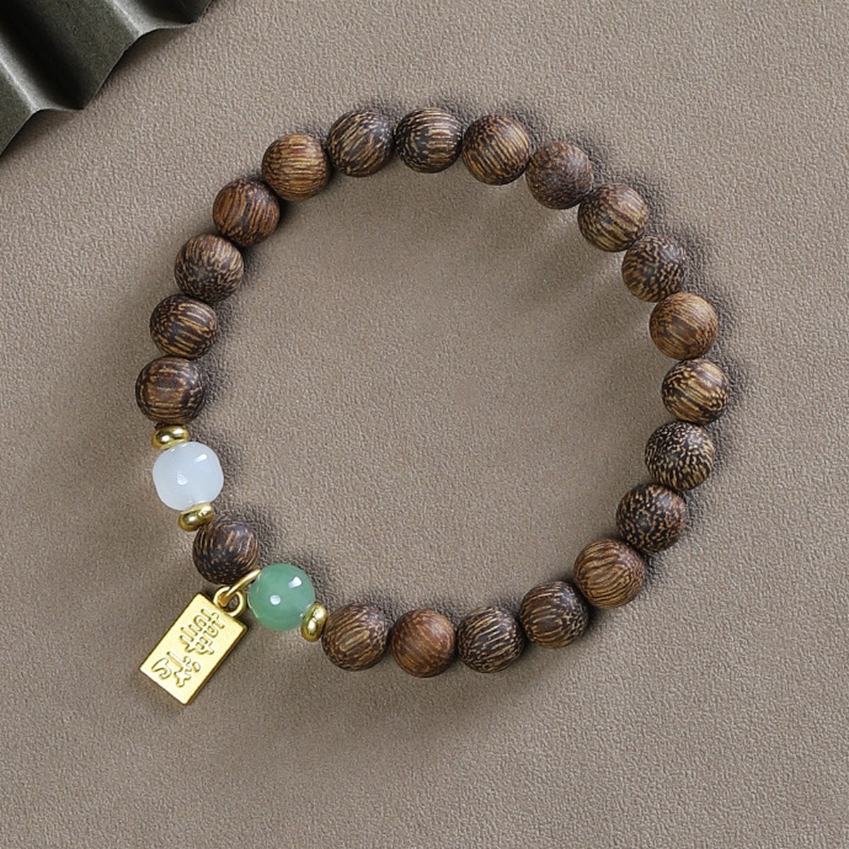 Woodgrain Prayer Bead Bracelet flat lay detail thumbnail