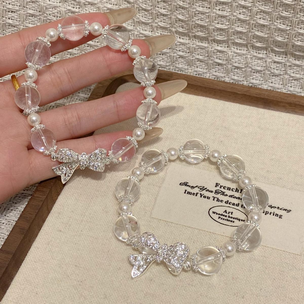 Clear Bow Crystal Bracelet flat lay detail thumbnail